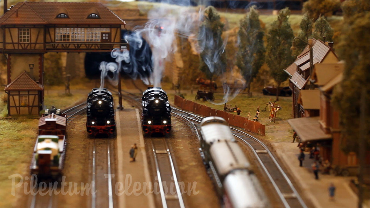 A pretty nice model railway in HO scale with smoking steam locomotives