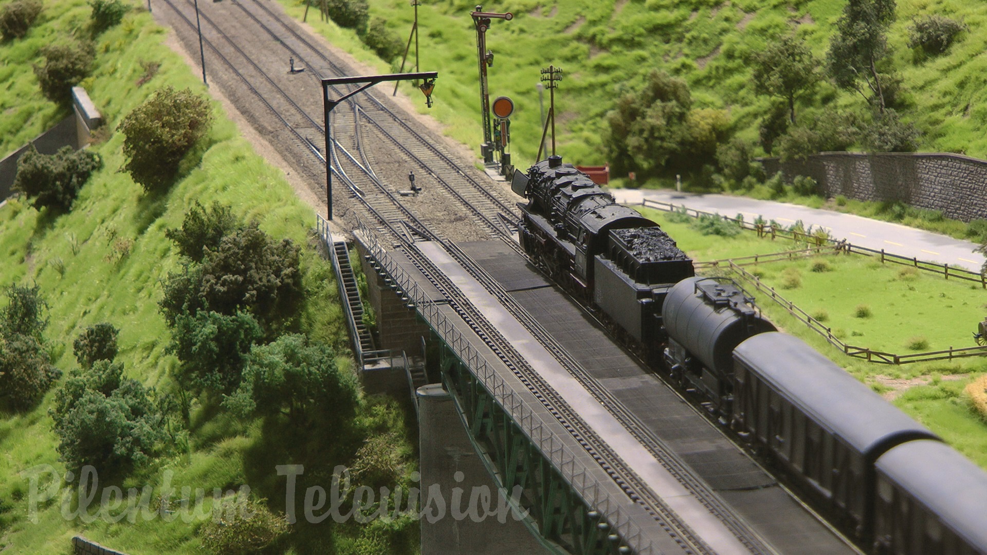 Steam Locomotive and Trains on a Model Railway Layout in HO Scale